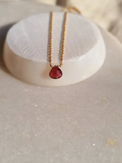 Another view of the 'ṣatra' Pink Tourmaline heart drop pendant. Its deep pink hue is perfect for anyone looking to invite more love and compassion into their life.