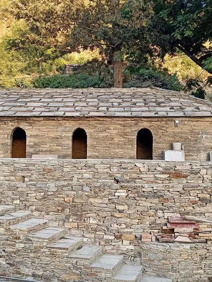 **Dharamshala Restoration, Uttarakhand:** The restored dharamshala sits on a stone plinth along the banks of the River Kosi. By reviving this lost piece of heritage, we aim to create economic opportunities for local youth and celebrate the region's history.