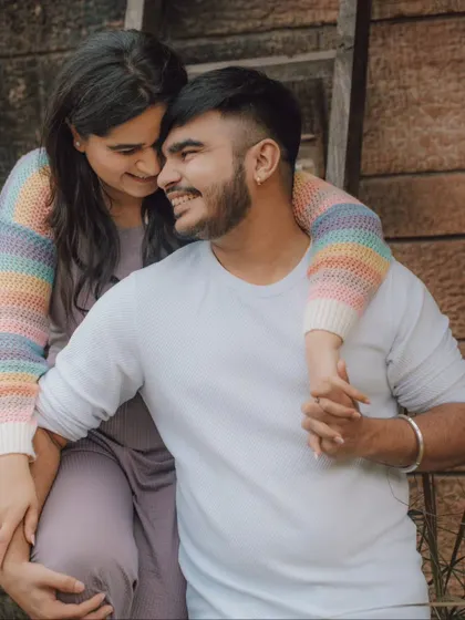 A happy, relaxed moment between a couple during their pre-wedding session. We aim to capture the smiles and easy comfort you share, creating photos that feel authentic and full of love.