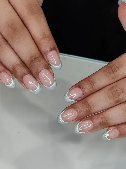 This full set shows the clean application of the baby blue French manicure. It's a perfect example of a simple design executed with precision.