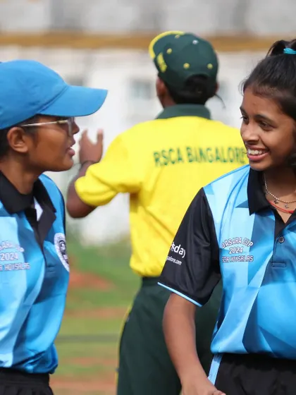 Players share a laugh on the field, showcasing the fun and camaraderie of the Dasara Cup.