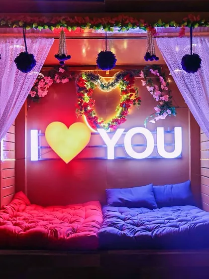 For those who love a bit of drama and romance, I offer these floor-seating cabanas. They are decorated with flowers and neon signs to make your pictures pop.