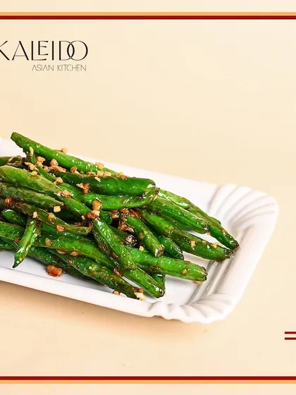 Who says veggie can't be delish? These wok-tossed green beans are simple, crunchy, and packed with garlic flavor, making them a perfect side dish for any party.