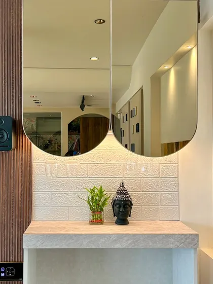 Another view from our Experience Center, highlighting how smart lighting can be used to accentuate decor pieces like this Buddha statue and mirrored cabinet.