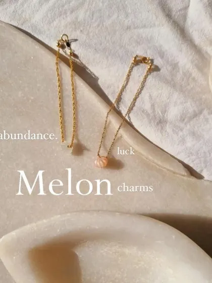 My 'Melon charms' collection is designed to bring specific energies into your life. This image shows both a Chrysoprase charm for sorrow and a Moonstone charm for luck.
