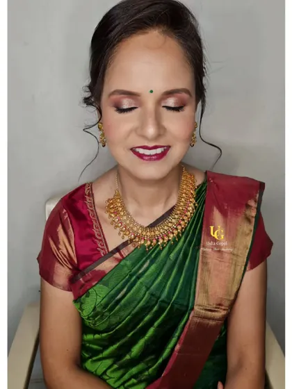 A close-up of Anushree's makeup, showing the soft shimmer on her eyelids and her radiant smile.