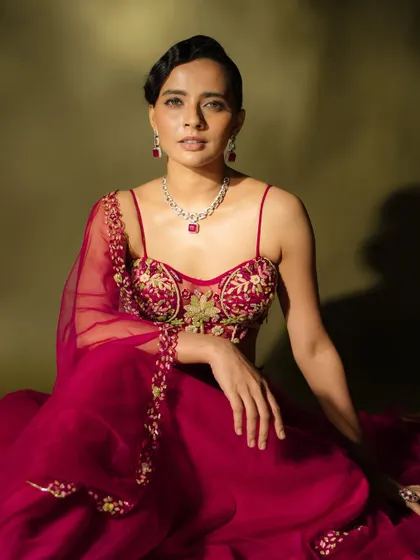 A thoughtful pose showing the details of the makeup. The subtle contouring and highlighting give the face dimension and a beautiful glow.