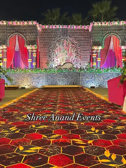 A head-on view of the magnificent stage, showcasing its detailed architecture and the beautiful floral arrangements at its base.