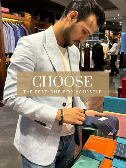 Here I am, Asad Kabir Karan, inspecting our new summer fabric collection. The process of curating the right materials is as important as the tailoring itself, ensuring every client receives the best.