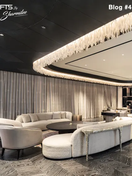A grand living space where our custom furniture helps to define the room's scale and flow. The curved sofas and armchairs are arranged to create an elegant and welcoming environment.