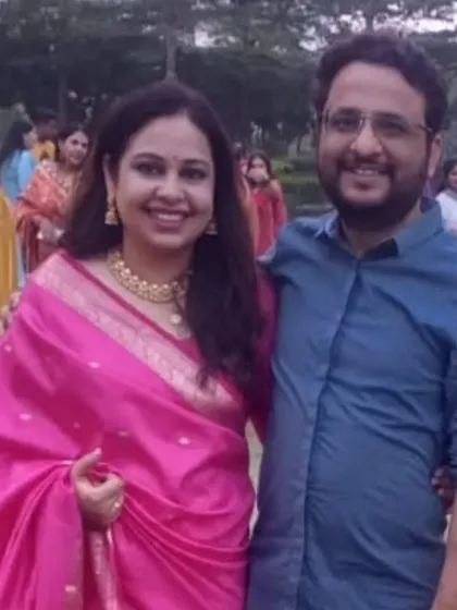A casual, happy photo of Jitesh and Pooja. Their story shows how different professional backgrounds can be united by a common spiritual foundation.