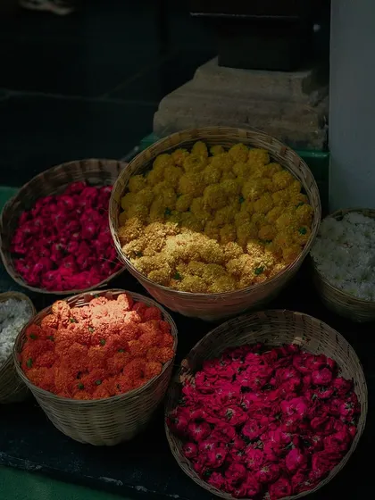 Baskets filled with flowers of various colors for the Haldi rituals.