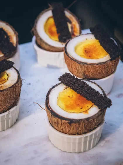 Our signature tender coconut crème brûlée, served in a natural coconut shell.