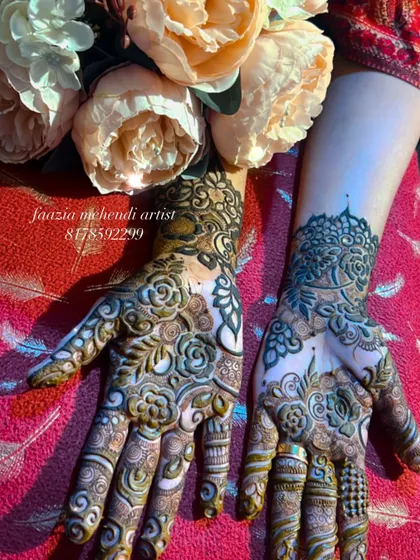 A top-down view of the completed floral henna design.