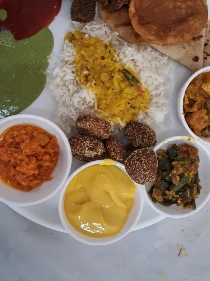 Another example of a delicious and colourful meal plate from a wedding in Airoli. It features a mix of traditional Maharashtrian and North Indian dishes.