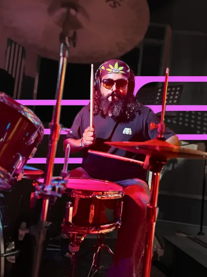 A drummer enjoying his moment on stage. Our community is made up of students of all ages and backgrounds, all sharing a passion for music.