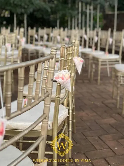 Cones of flower petals placed on each guest's chair. This small detail invites guests to be a part of the celebration by showering the couple with blessings.