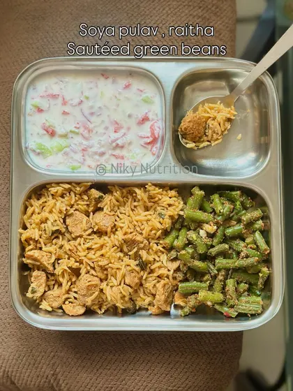 Enjoy this protein-packed soya pulav, a flavorful one-pot rice dish, served with cooling raita and sautéed green beans for a complete and wholesome meal.
