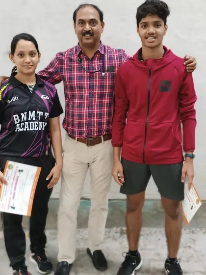 Coach Krunal Telang with our champions Deshna and Srikanth after their medal wins at the state ranking tournament.