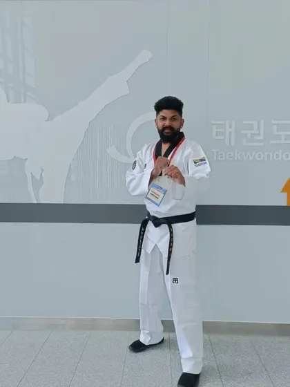 Posing at the Taekwondowon, the heart of global Taekwondo.