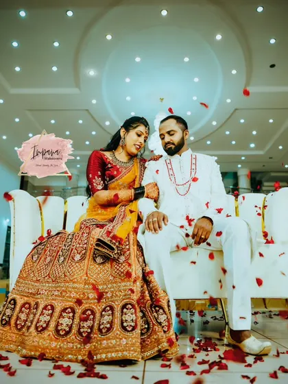 A romantic shot of the couple at their reception. The bride's lehenga look is complemented by a natural and glossy makeup style that enhances her glow.