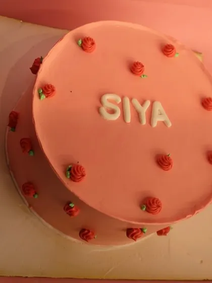 The top-down view of the pretty pink naming ceremony cake.