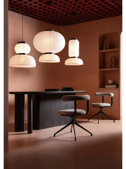 A retail space should also be a functional workspace for the brand. In this section of the showroom, we designed a client consultation area with a custom dark wood table and sculptural paper lanterns, blending business with beauty.