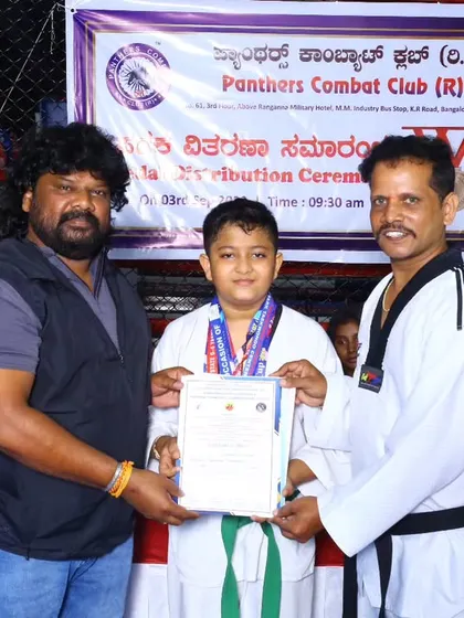 Dr. Different Danny awarding a medal and certificate to one of our young champs. We believe in celebrating every achievement to motivate our students for future success.