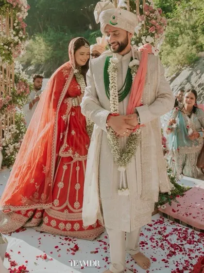 A candid shot from a breathtaking destination wedding in Rishikesh. The bride's soft and effortless makeup allowed her natural joy to shine through against the divine backdrop of the Ganga.