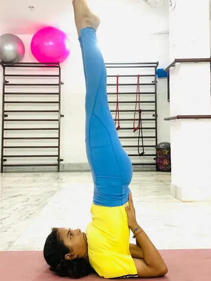 Sarvangasana (Shoulder Stand) is known as the "queen of all asanas" for its wide-ranging benefits, including calming the nervous system and improving circulation to the brain. I guide practitioners safely into this inversion.