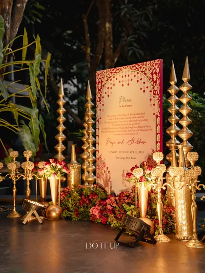 The entrance to the phera ceremony, styled with traditional brass lamps ('diyas') and floral arrangements. This set a sacred and welcoming tone for the guests.