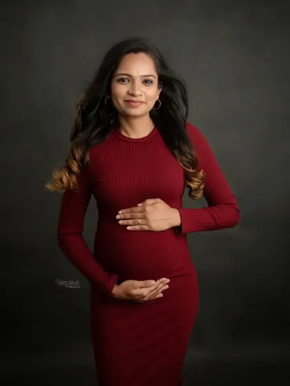 A classic solo maternity portrait. You look so radiant and confident, cradling your bump in this lovely red dress. A beautiful memory to cherish.