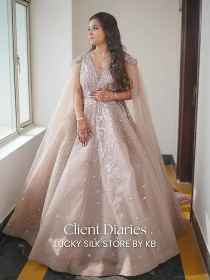 A happy client looking serene and beautiful in a pastel caped gown. This is the kind of effortless elegance I love to create for my brides.