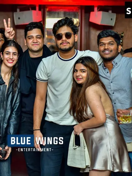 Another group enjoying the Bollywood night, posing with confidence. The vibe is immaculate.