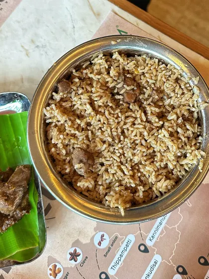 A serving of my authentic Mutton Palav in a traditional steel bowl. You can see the tender pieces of lamb mixed with the perfectly cooked, flavour-infused rice.