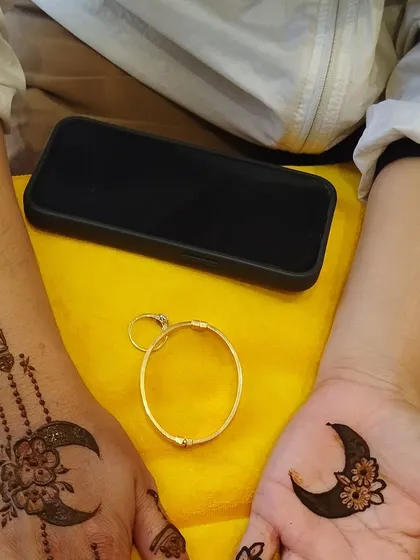 A simple yet beautiful Eid design with a crescent moon on the palm and a hanging lantern on the wrist. Perfect for those who want a minimal but festive touch.