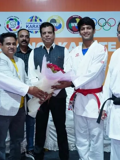 A moment of felicitation with an athlete at the Kumite seminar in Pune. We ensure our top athletes are present at these events to inspire the younger participants.