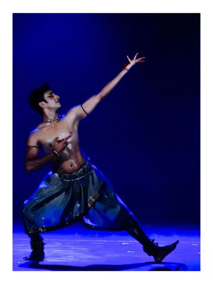 A powerful and dramatic pose from a solo performance. The strong lines and intense expression are key elements of my style.