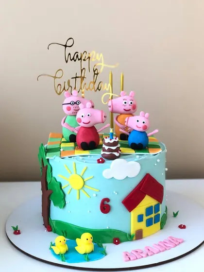 A perfect picnic day with Peppa Pig and her family. This cake features a bright, sunny scene with the beloved characters enjoying the outdoors.