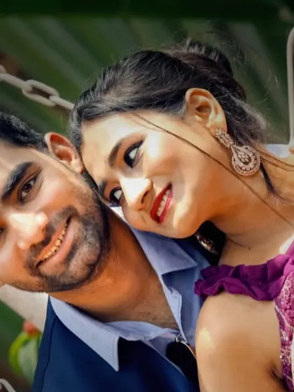 A sweet and gentle moment captured during a pre-wedding photoshoot on a swing.