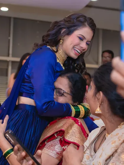 A heartwarming moment with family. The bride's makeup is designed to look great in every photo, capturing these precious memories.