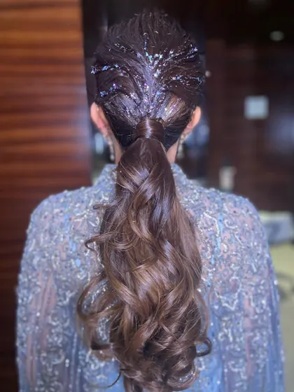 A close-up of the glitter ponytail, showing how it sparkles and shines under the lights.