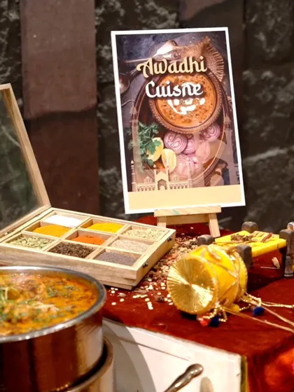We take pride in showcasing regional cuisines. This setup for Awadhi Cuisine features a traditional spice box, highlighting the authentic ingredients we use to create the flavors of Lucknow.