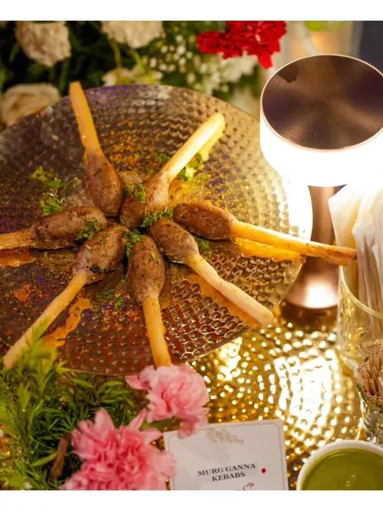 Our innovative Murg Ganna Kebabs, where minced chicken is molded onto sugarcane sticks and grilled, infusing a subtle sweetness.