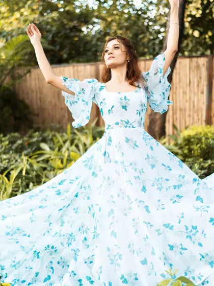 An expressive, joyful pose from the floral dress shoot. Capturing this kind of positive energy makes the photos feel authentic and relatable.
