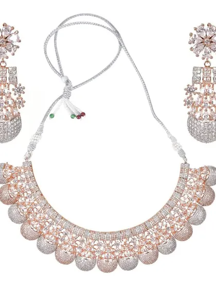This beautiful rose-gold and silver dual-tone necklace set is perfect for receptions or cocktail parties. The design features floral studs and a choker adorned with American Diamonds.
