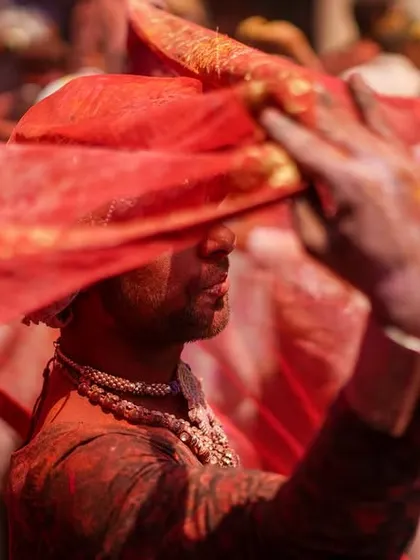 A vibrant collection of images from the Holi celebrations in Braj, specifically Nandgaon. This series captures the pure ecstasy of the festival, with portraits of devotees, men dressed as gopis, and crowds dancing in a cloud of colors.