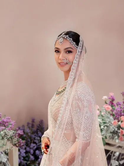 Hemangini looked ethereal in her pastel Falguni Shane Peacock lehenga. The makeup was kept soft and shimmery to match the intricate silver work on her outfit.