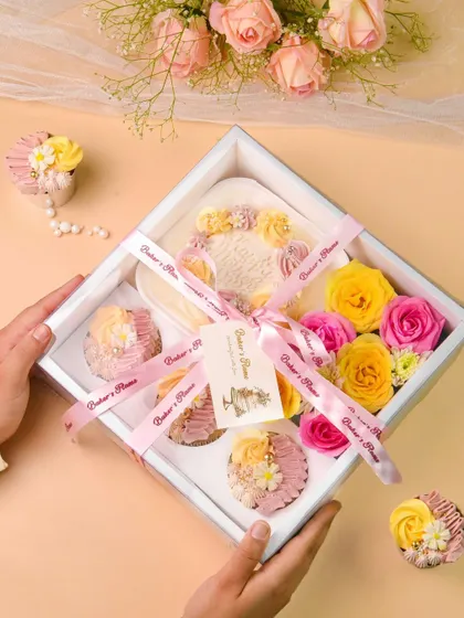 A lifestyle shot of a bakery gift box being held. Including hands in the photo adds a human touch and helps show the scale of the product.