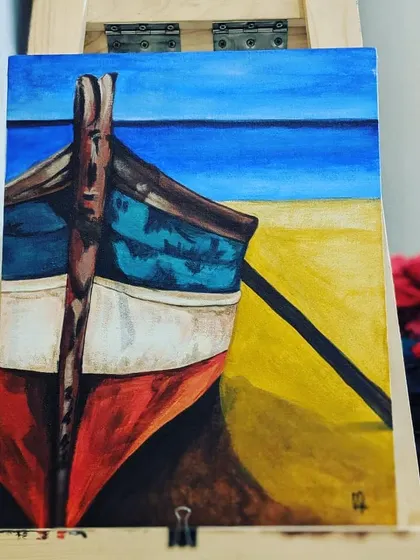 An acrylic painting of a boat on a beach, created during a practice session. I'm always experimenting with colors and compositions to refine my skills.